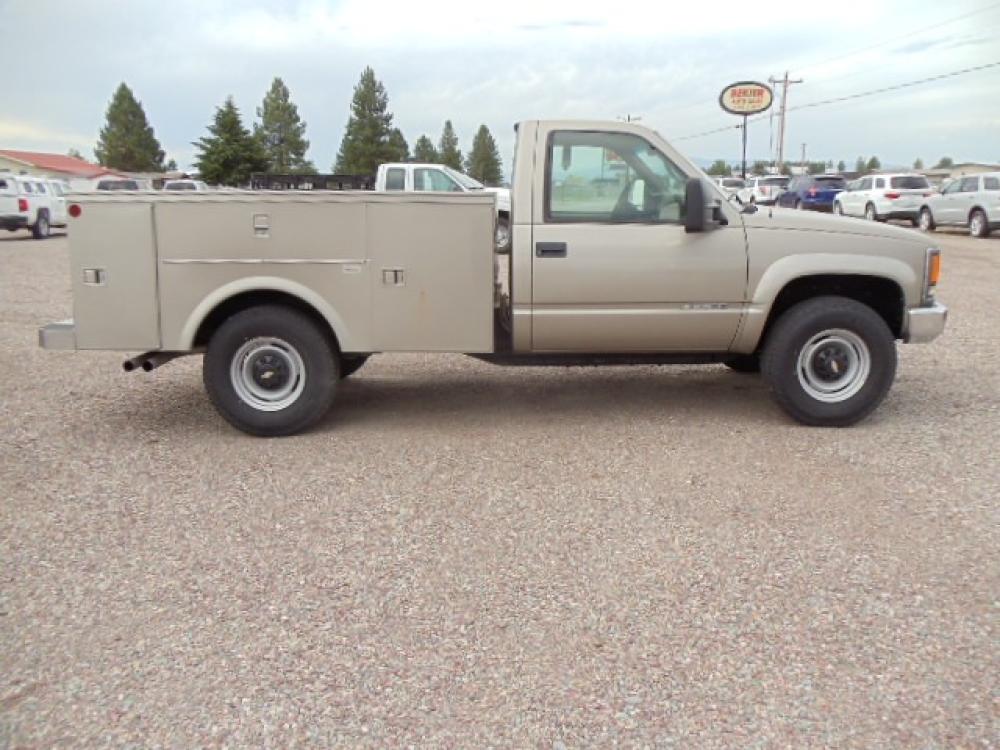 2000 Tan /Tan Chevrolet C/K 2500 Work Truck (1GBGK24R5YF) with an 5.7L V8 OHV 16V engine, Automatic transmission, located at 5465 Highway 2 W., Columbia Falls, MT, 59912, (406) 892-4407, 48.352188, -114.240929 - This truck is equipped with AC only 8 Foot Utility Box Good tires - Photo #9