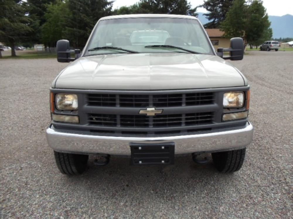 2000 Tan /Tan Chevrolet C/K 2500 Work Truck (1GBGK24R5YF) with an 5.7L V8 OHV 16V engine, Automatic transmission, located at 5465 Highway 2 W., Columbia Falls, MT, 59912, (406) 892-4407, 48.352188, -114.240929 - This truck is equipped with AC only 8 Foot Utility Box Good tires - Photo #1