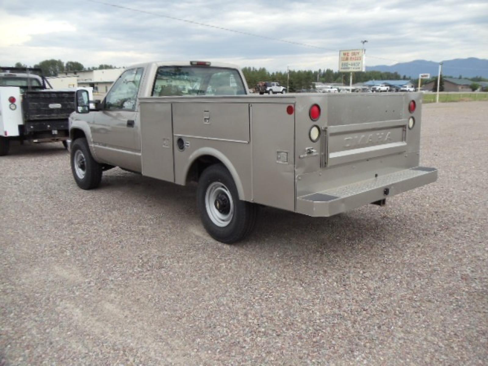 2000 Tan /Tan Chevrolet C/K 2500 Work Truck (1GBGK24R5YF) with an 5.7L V8 OHV 16V engine, Automatic transmission, located at 5465 Highway 2 W., Columbia Falls, MT, 59912, (406) 892-4407, 48.352188, -114.240929 - This truck is equipped with AC only 8 Foot Utility Box Good tires - Photo #4