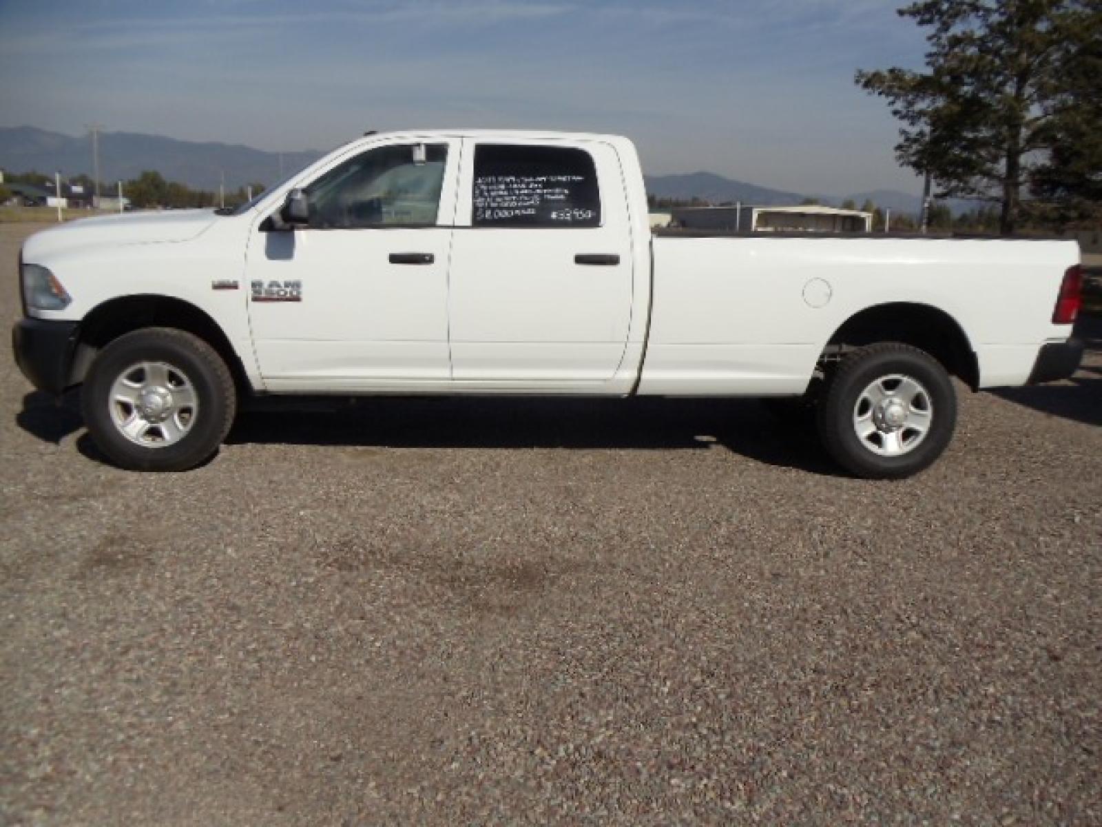 2014 White /Grey RAM 3500 Tradesman (3C63R3GT8EG) with an 5.7L V8 OHV 16V engine, 6-Speed Automatic transmission, located at 5465 Highway 2 W., Columbia Falls, MT, 59912, (406) 892-4407, 48.352188, -114.240929 - Photo #3