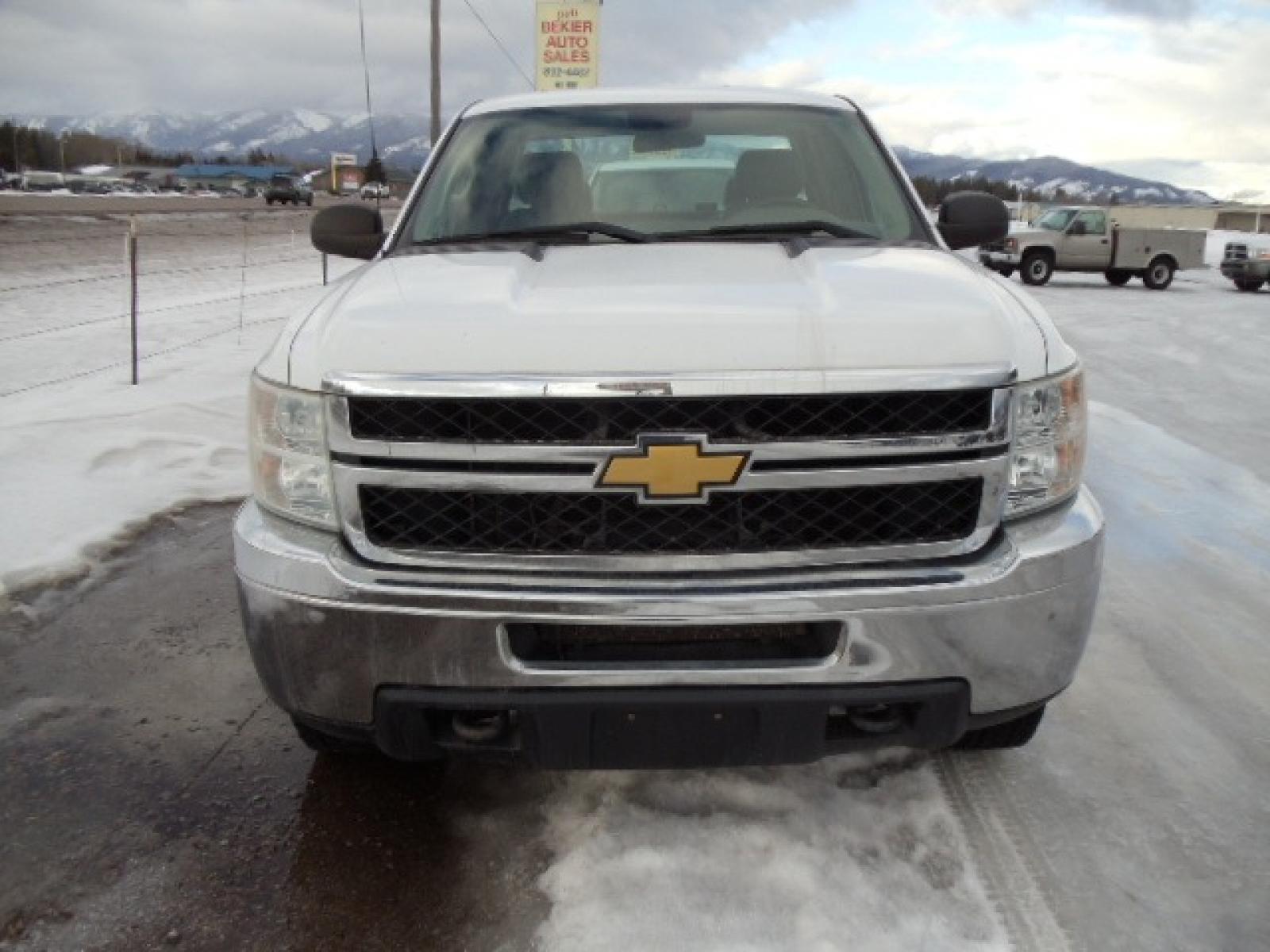 2012 White /Gray Chevrolet Silverado 2500HD Work Truck Ext. Cab 4WD (1GC2KVCG0CZ) with an 6.0L V8 OHV 16V FFV engine, 6-Speed Automatic transmission, located at 5465 Highway 2 W., Columbia Falls, MT, 59912, (406) 892-4407, 48.352188, -114.240929 - This truck was previously owned by the federal government so it has been well maintained and taken care of. This truck is very clean inside and out with good tires and low miles. This is the quad door short box with the 6.0L V8 gas motor. - Photo #1