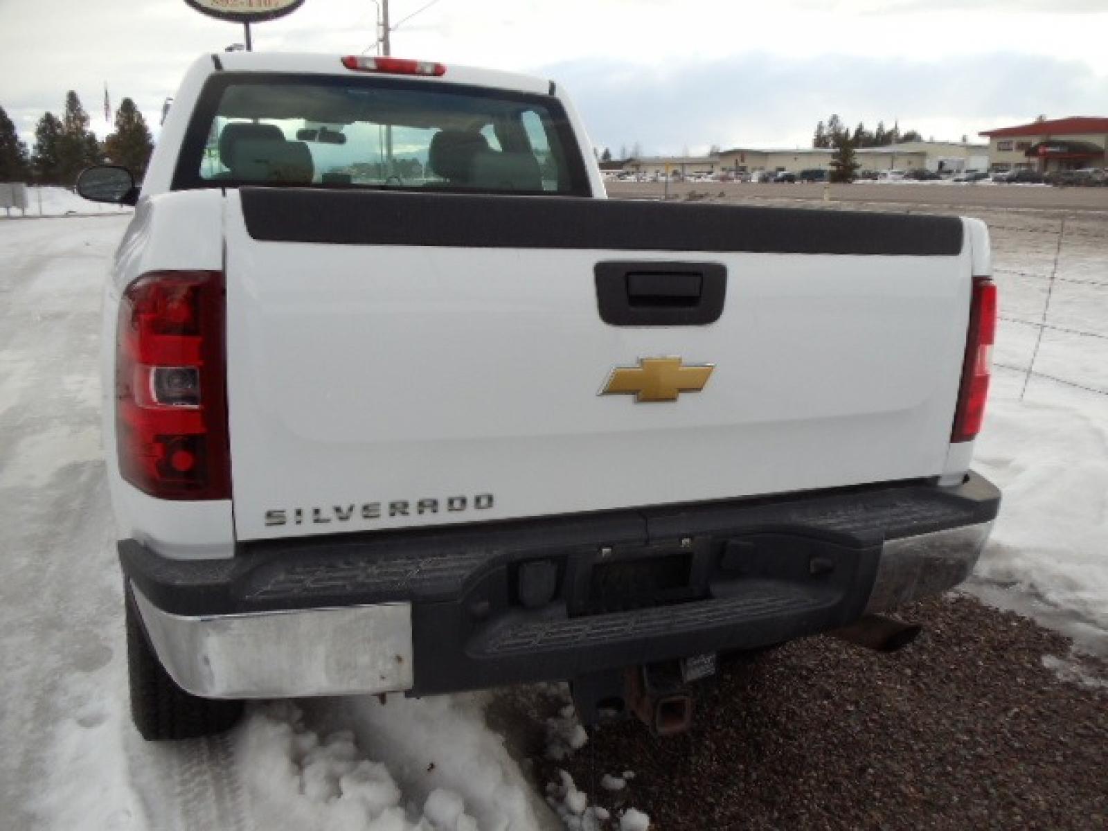 2012 White /Gray Chevrolet Silverado 2500HD Work Truck Ext. Cab 4WD (1GC2KVCG0CZ) with an 6.0L V8 OHV 16V FFV engine, 6-Speed Automatic transmission, located at 5465 Highway 2 W., Columbia Falls, MT, 59912, (406) 892-4407, 48.352188, -114.240929 - This truck was previously owned by the federal government so it has been well maintained and taken care of. This truck is very clean inside and out with good tires and low miles. This is the quad door short box with the 6.0L V8 gas motor. - Photo #5