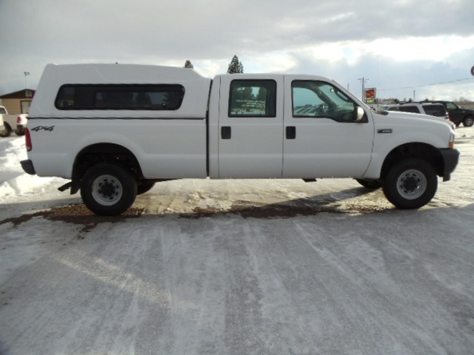 2004 Gray /Gray Ford F-350 SD XL Crew Cab 4WD (1FTSW31L04E) with an 5.4L V8 SOHC 16V engine, 6 Speed Manual transmission, located at 5465 Highway 2 W., Columbia Falls, MT, 59912, (406) 892-4407, 48.352188, -114.240929 - This truck was previously owned by the federal government so it has been well maintained and taken care of. The truck is clean inside and out with good tires and low actual miles. This is the crew cab long box with the 5.4L V8 gas motor. This vehicle is rare with the 6 speed manual transmission. - Photo #9