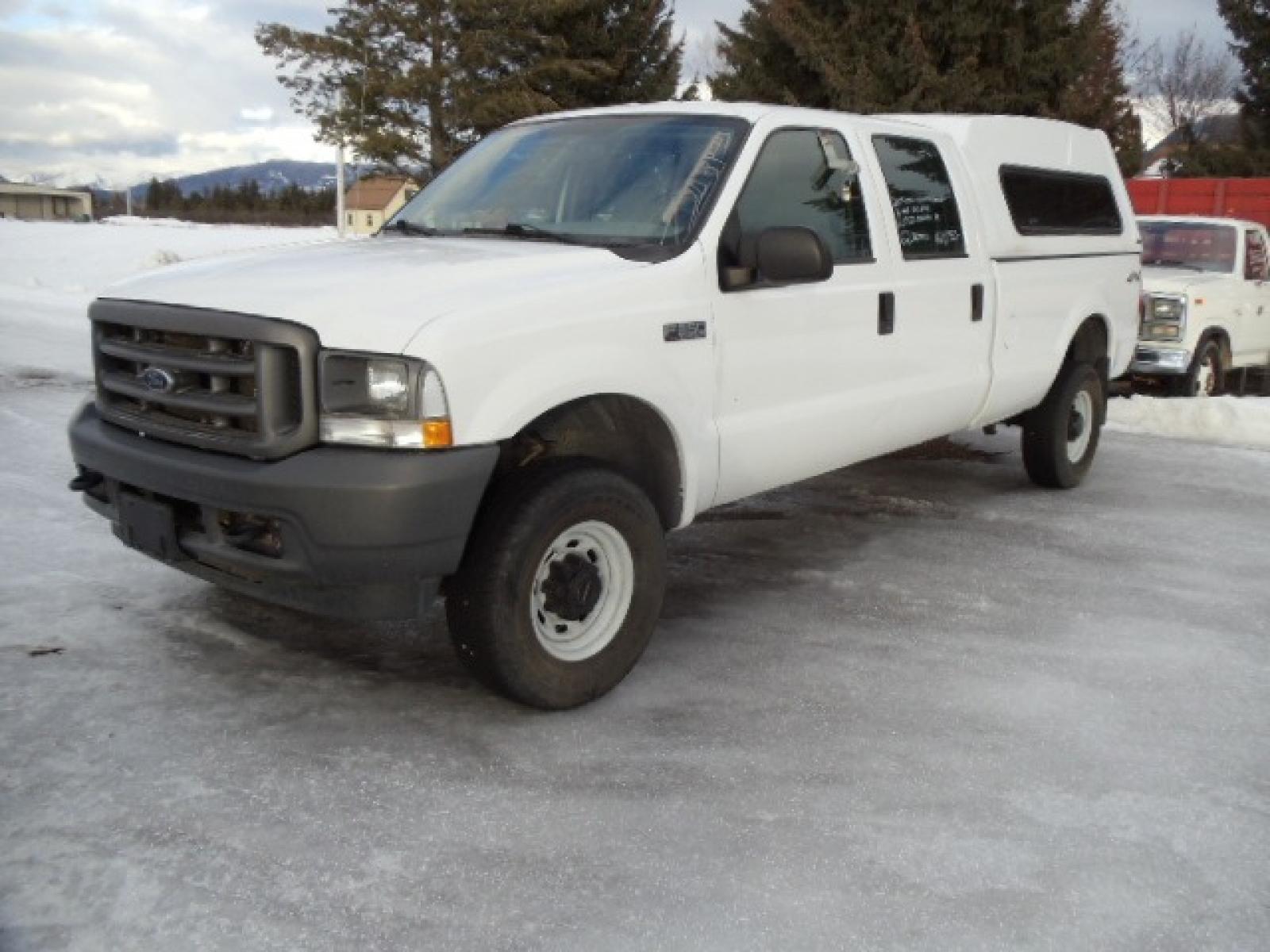 2004 Gray /Gray Ford F-350 SD XL Crew Cab 4WD (1FTSW31L04E) with an 5.4L V8 SOHC 16V engine, 6 Speed Manual transmission, located at 5465 Highway 2 W., Columbia Falls, MT, 59912, (406) 892-4407, 48.352188, -114.240929 - This truck was previously owned by the federal government so it has been well maintained and taken care of. The truck is clean inside and out with good tires and low actual miles. This is the crew cab long box with the 5.4L V8 gas motor. This vehicle is rare with the 6 speed manual transmission. - Photo #2