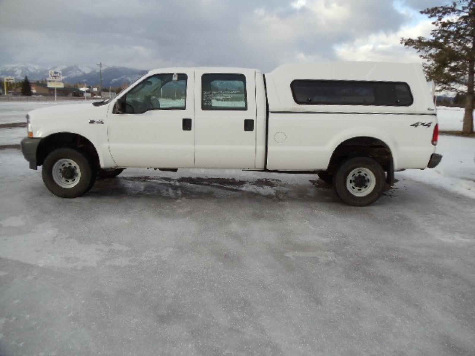 2004 Gray /Gray Ford F-350 SD XL Crew Cab 4WD (1FTSW31L04E) with an 5.4L V8 SOHC 16V engine, 6 Speed Manual transmission, located at 5465 Highway 2 W., Columbia Falls, MT, 59912, (406) 892-4407, 48.352188, -114.240929 - This truck was previously owned by the federal government so it has been well maintained and taken care of. The truck is clean inside and out with good tires and low actual miles. This is the crew cab long box with the 5.4L V8 gas motor. This vehicle is rare with the 6 speed manual transmission. - Photo #3