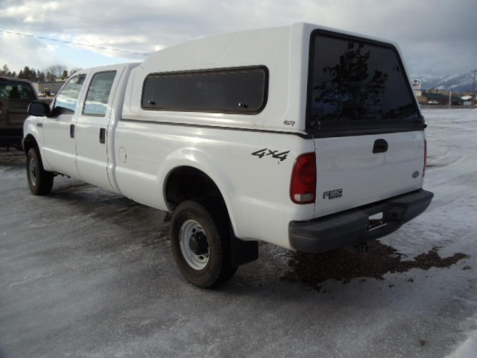 2004 Gray /Gray Ford F-350 SD XL Crew Cab 4WD (1FTSW31L04E) with an 5.4L V8 SOHC 16V engine, 6 Speed Manual transmission, located at 5465 Highway 2 W., Columbia Falls, MT, 59912, (406) 892-4407, 48.352188, -114.240929 - This truck was previously owned by the federal government so it has been well maintained and taken care of. The truck is clean inside and out with good tires and low actual miles. This is the crew cab long box with the 5.4L V8 gas motor. This vehicle is rare with the 6 speed manual transmission. - Photo #4