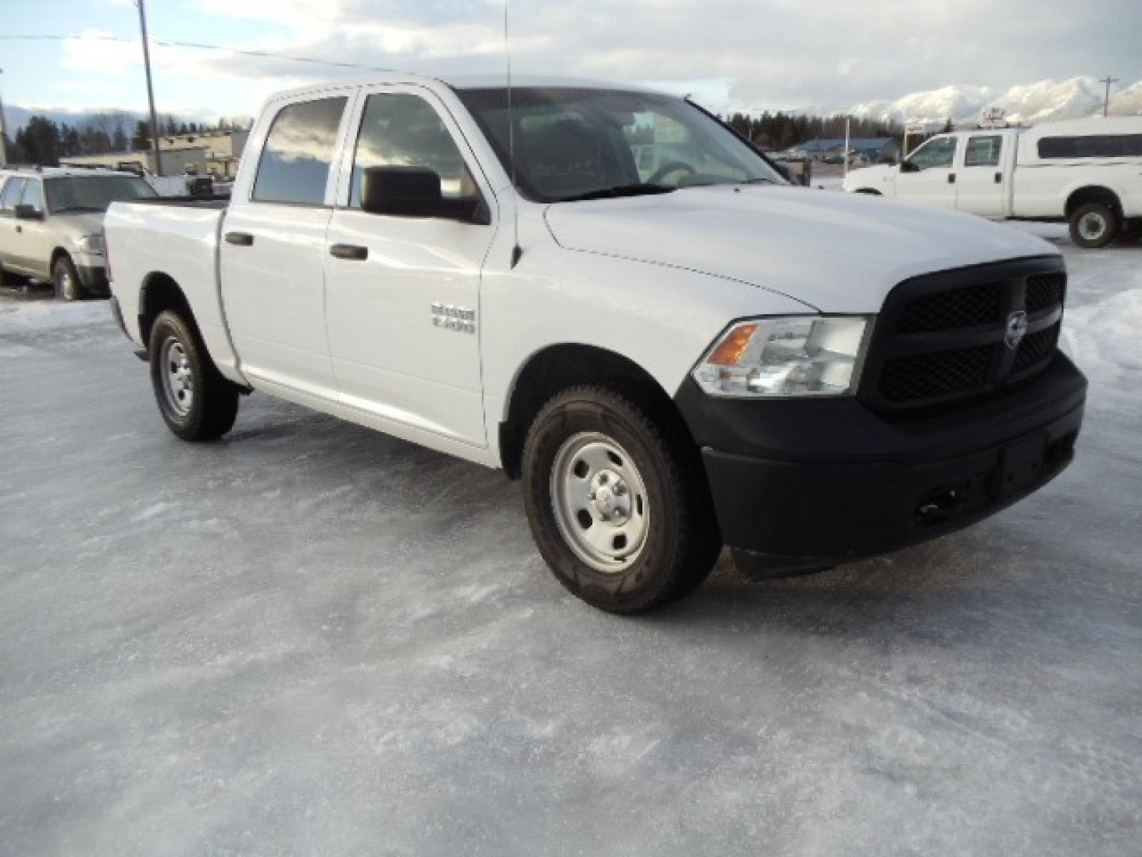 2014 Gray /Gray RAM 1500 Tradesman Crew Cab SWB 4WD (1C6RR7KG3ES) with an 3.6L V6 DOHC 24V FFV engine, 6-Speed Automatic transmission, located at 5465 Highway 2 W., Columbia Falls, MT, 59912, (406) 892-4407, 48.352188, -114.240929 - This truck was previously owned by the federal government so it has been well maintained and taken care of. The vehicle is very clean inside and out with great tires and low miles. This is the crew cab short box. - Photo #0