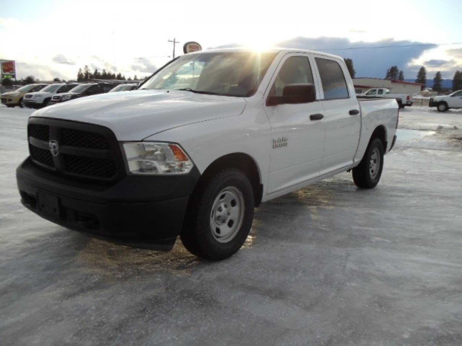 2014 Gray /Gray RAM 1500 Tradesman Crew Cab SWB 4WD (1C6RR7KG3ES) with an 3.6L V6 DOHC 24V FFV engine, 6-Speed Automatic transmission, located at 5465 Highway 2 W., Columbia Falls, MT, 59912, (406) 892-4407, 48.352188, -114.240929 - This truck was previously owned by the federal government so it has been well maintained and taken care of. The vehicle is very clean inside and out with great tires and low miles. This is the crew cab short box. - Photo #2